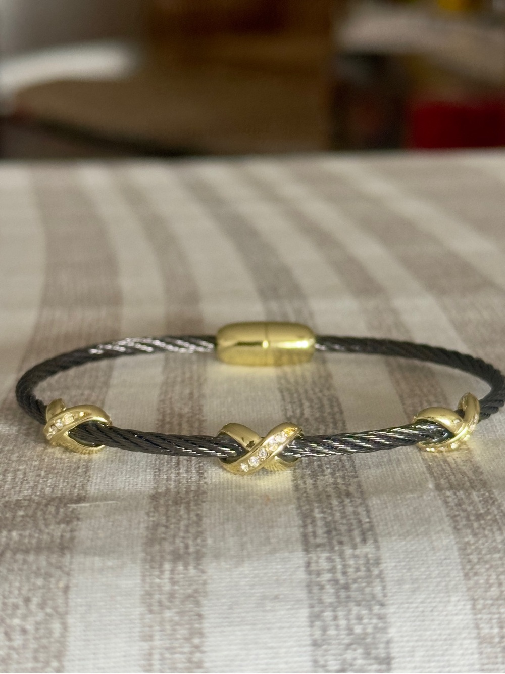 Black Twisted Cable and Gold Pavé X Stations Bracelet.